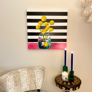 24" x 24" acrylic on canvas. Vase of yellow billy button flowers on pink table on black and white horizontal stripe background by West Virginia artist Emily Kurth.