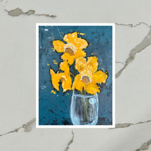 Load image into Gallery viewer, Printed artwork by artist Emily Kurth of yellow daffodil flowers in a blue vase on a blue background.