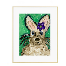 Load image into Gallery viewer, A painting featuring a beige bunny with a purple flower on its head, set against a green background, presented in a framed print format.