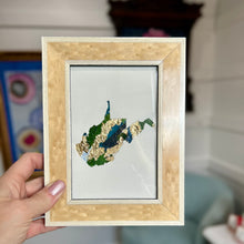Load image into Gallery viewer, Blonde lacquered wood framed cutout of West Virginia with gold leaf and green, turquoise, and navy paint chips from artist Emily Kurth's palette.