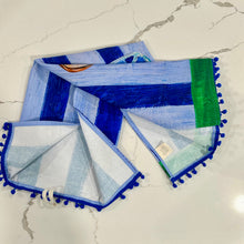 Load image into Gallery viewer, Decorative tea towel with iced tea on royal and light blue striped background on marble surface.