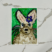 Load image into Gallery viewer, Painting of a rabbit with flowers on a green background, on a marble surface.