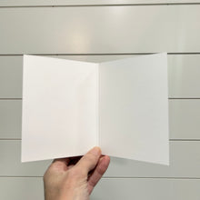 Load image into Gallery viewer, Hand holding a white card against a light wooden panel background