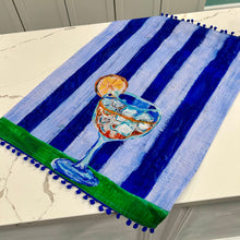 Load image into Gallery viewer, Decorative tea towel with iced tea on royal and light blue striped background design on marble surface.