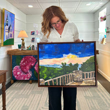 Load image into Gallery viewer, Woman holding a framed of a scenic landscape of Cooper's Rock overlook in West Virginia with a wooden deck, stone wall, and trees.