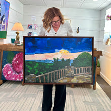 Load image into Gallery viewer, Woman holding a framed painting of a scenic landscape of Cooper's Rock overlook in West Virginia with a wooden deck, stone wall, and trees.