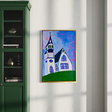 Load image into Gallery viewer, Framed painting of a colorful house on a white wall next to a green cabinet.
