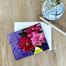 Load image into Gallery viewer, Greeting card of colorful rhododendron floral painting on a wooden surface with a vase of flowers in the background.
