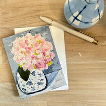Load image into Gallery viewer, Notebook with pink hydrangea floral design on a wooden surface with a pen and small vase.