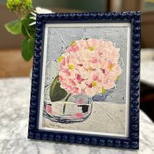 Load image into Gallery viewer, Framed artwork of pink flowers in a glass jar on a marble surface.