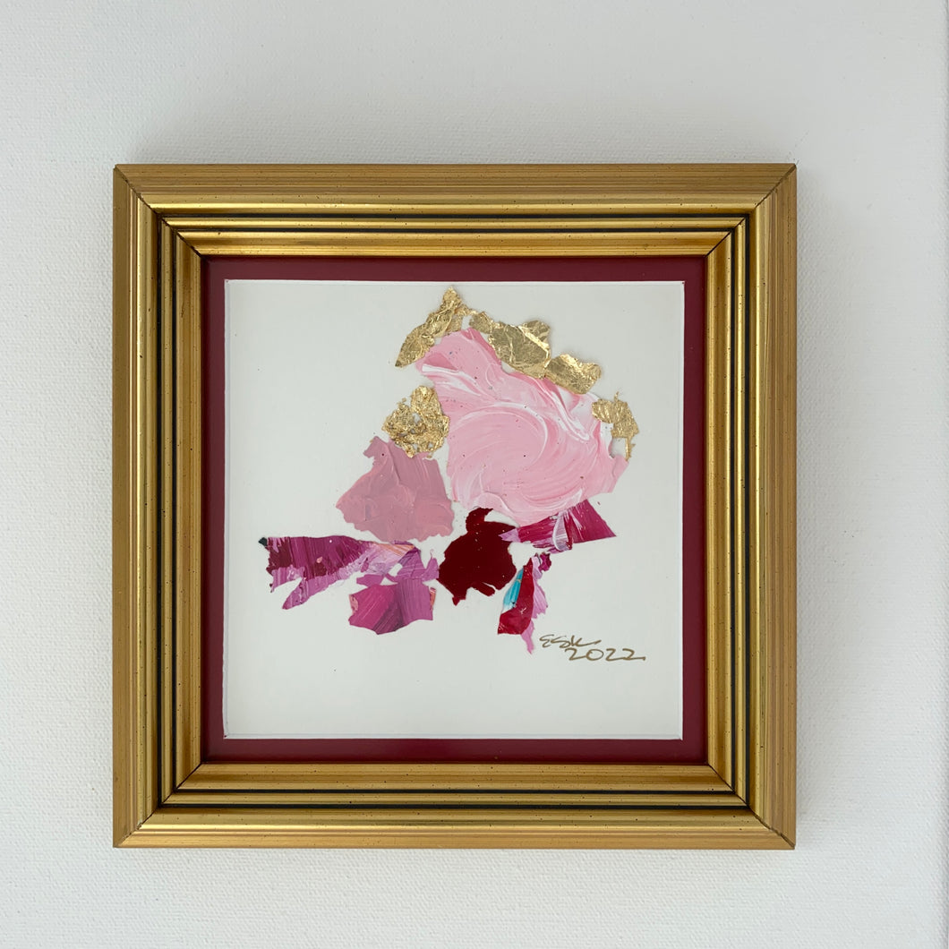 Pink paint chips in abstract art.  Brushed gold frame. 7.75