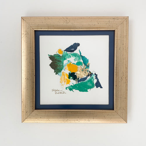 Blue, yellow, and green paint chips in abstract art.  Brushed champagne frame. 7.5
