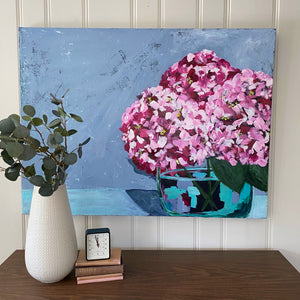 36"x 48" painting of pink hydrangeas in glass vase.  Light blue background.  Emily Kurth artist.